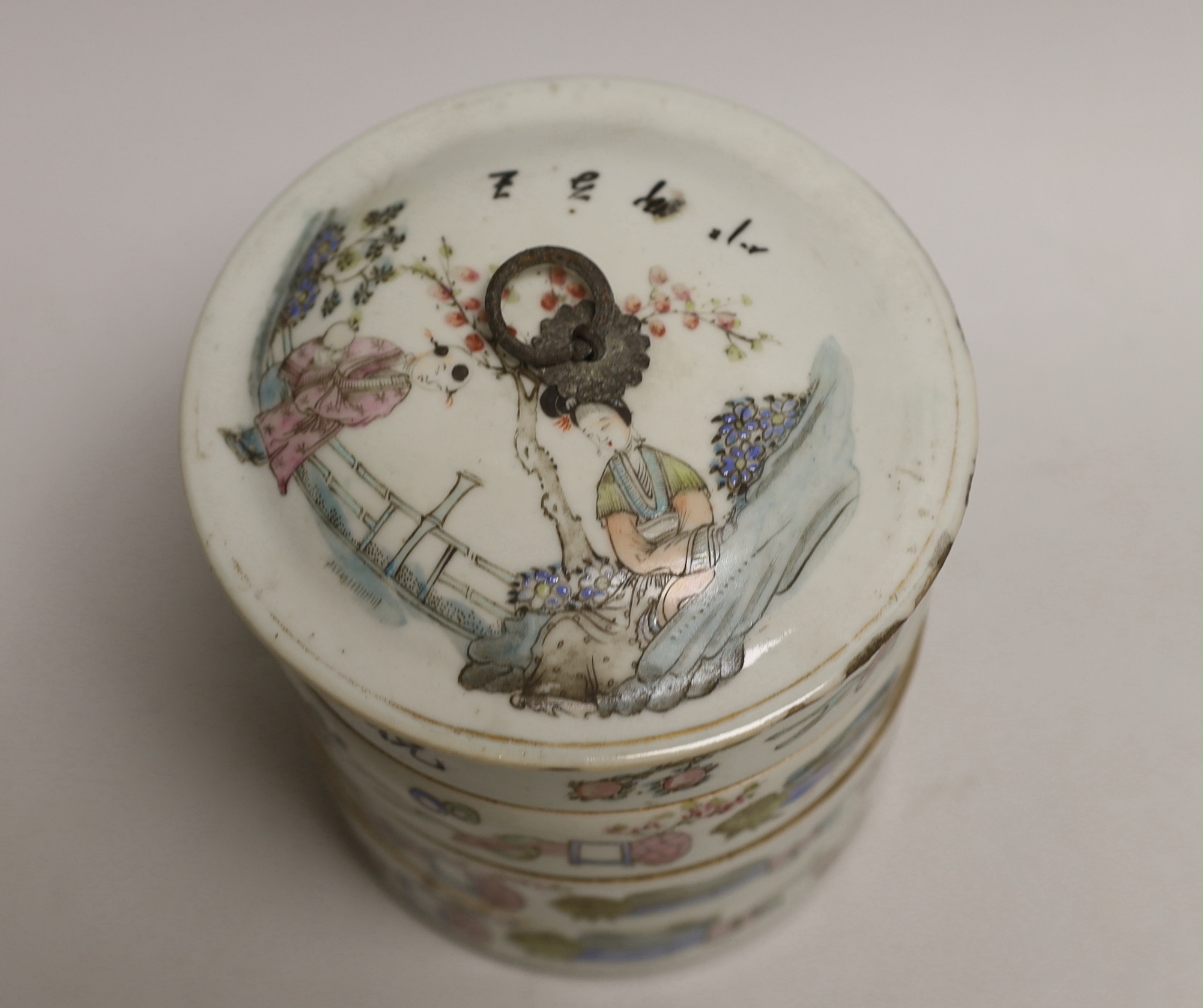 An early 20th century Chinese four section food container hand painted in the famille rose palette, 14cm high